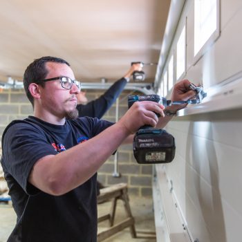 Associated Garage Door staff installing new garage door