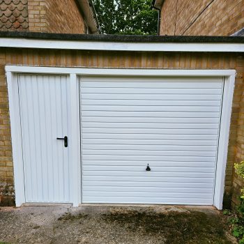 Matching white garage door and side door