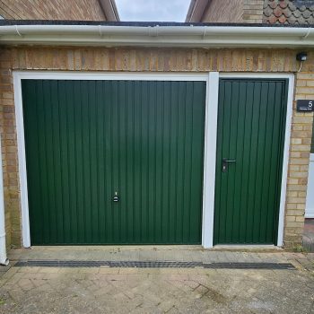 Dark green matching garage door with side door