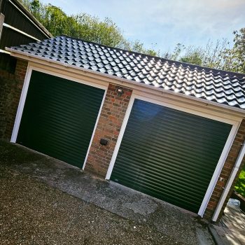 Matching single garage door in dark green